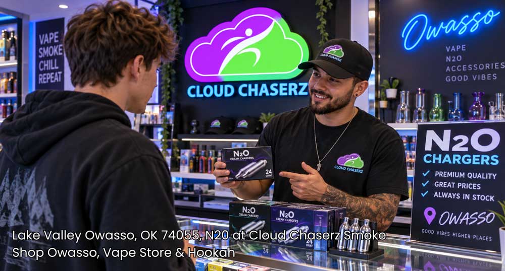 Store employee demonstrating cream chargers at Cloud Chaserz, a top local shop for quality N2O Owasso products.