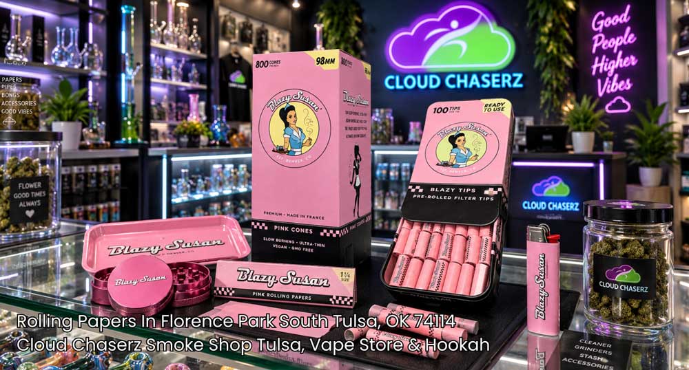 Pink rolling tray, grinder, and pre-rolled cones showcased at Cloud Chaserz, carrying the best rolling papers Tulsa smokers buy.