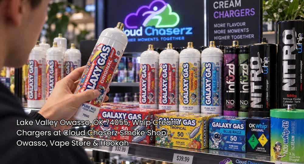 Customer holding a Galaxy Gas tank while browsing whip cream chargers Owasso products on the smoke shop shelf.